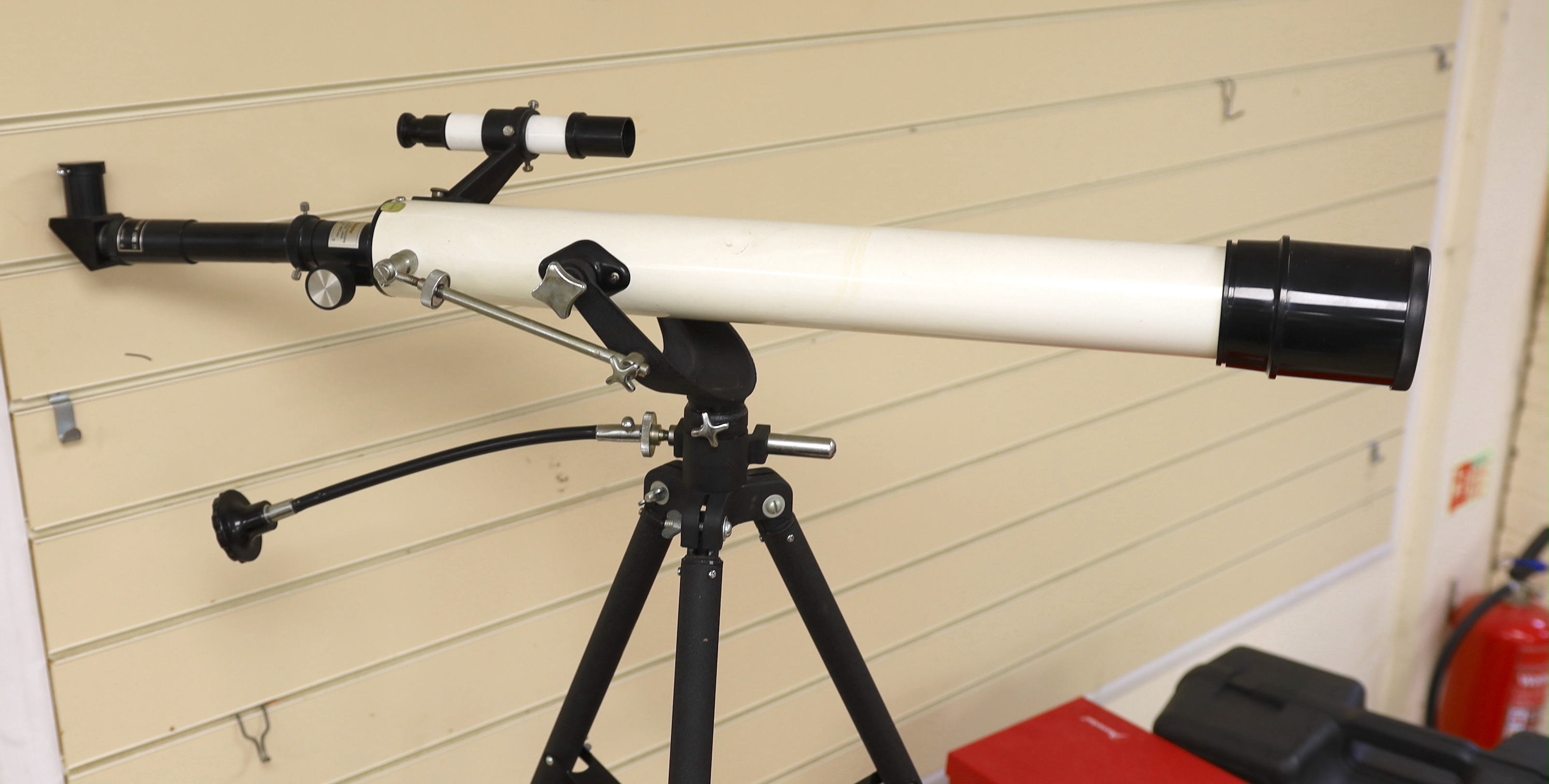 A telescope on tripod stand and a Meade scope and tripod, telescope and stand 105cm high